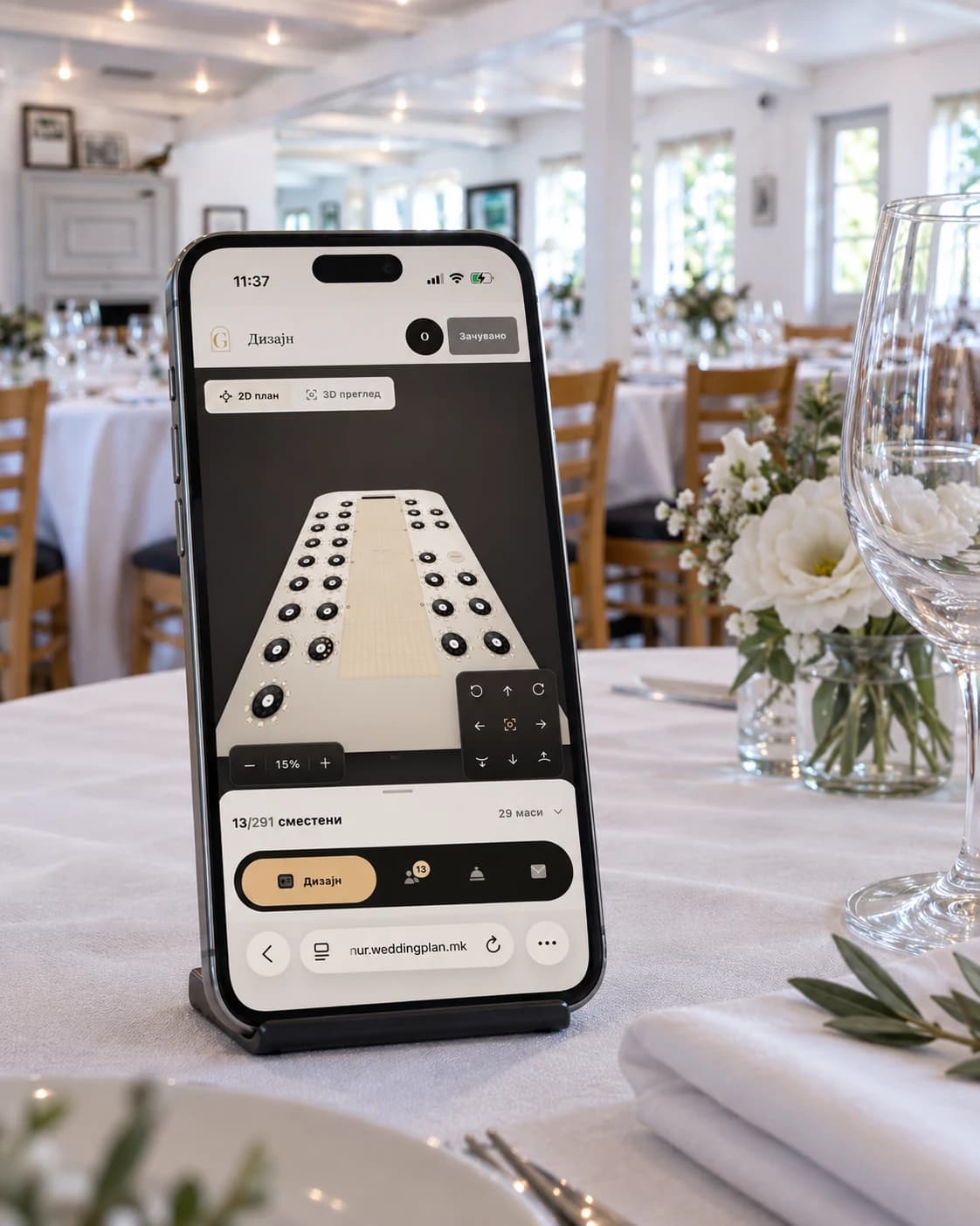 Weddingplan’s mobile seating layout displayed on a phone resting on a reception table